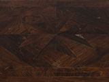 a close up of a wooden table with a star design on it