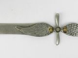 an image of a knife with wings on it on a white surface