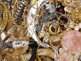 a pile of jewelry that is sitting on a table