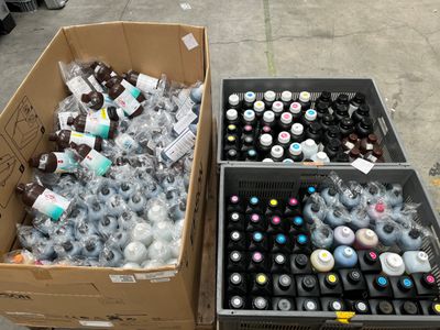 two boxes full of bottles of soda and a box full of bottles of beer