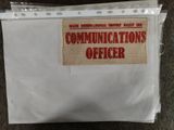 a bag that has a label on it that says communications officer