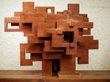 a sculpture made of wood blocks sitting on a table