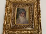 a painting of a bearded man with a turban on the wall
