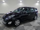 a picture of a black minivan parked on a checkered floor