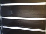 a refrigerator that has a lot of empty shelves in it