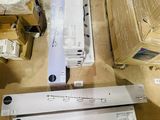 many boxes of electronic equipment sitting on a table