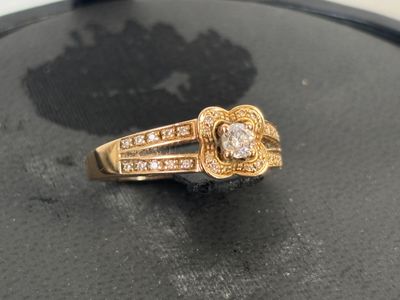 an image of a gold ring with diamonds on it