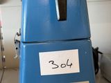 a blue refrigerator that has a sticker on it