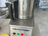 a blender that is sitting on a counter in a kitchen