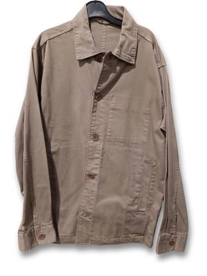 an image of a jacket hanging on a hanger on a white wall