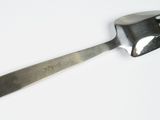 a fork that is sitting on a white surface