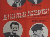 une vieille affiche de cinéma représentant trois hommes coiffés de chapeaux et portant la moustache