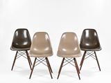 three eames chairs in different colors and sizes on a white background