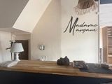 a picture of a kitchen with a bar in the middle of it