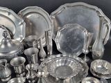 a lot of silver items that are on a table