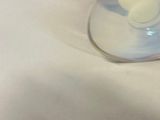a baby bottle that is sitting on a table