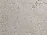 an image of a white relief of a man and a woman
