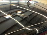 a black car that has a remote control on top of it
