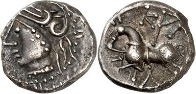 a silver coin with an image of a bird on it