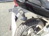 a close up of a motorcycle parked on the side of the road