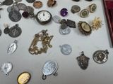 a table with many different types of jewelry on it