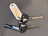 two keys that are sitting on a table