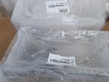 packaging of two plastic containers sitting on top of a cardboard box