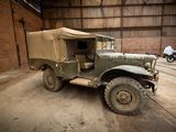 an old military vehicle parked in a garage