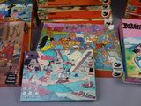 a lot of books that are sitting on a table