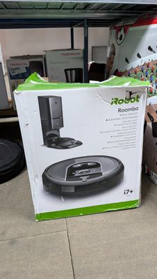 a box with a remote and a remote control on the floor
