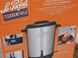 packaging of a slow cooker sitting on the floor in a store