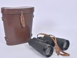 two binoculars sitting next to each other on a white surface