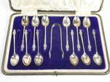 silver plated spoons and spoons in a case with velvet lining