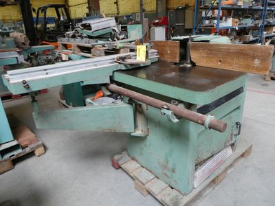a machine that is sitting in a warehouse with other machines