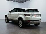 a white range rover parked in a garage