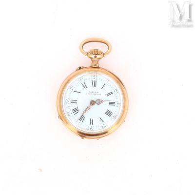 a gold pocket watch with roman numerals on the face