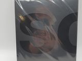 a close up of a box with a picture of a person holding a cell phone