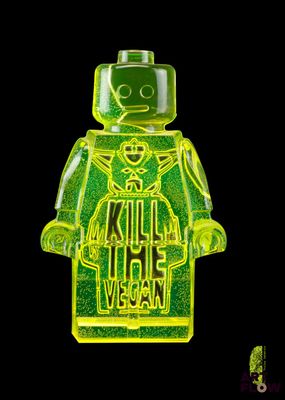 un bonhomme Lego jaune tenant une pancarte sur laquelle on peut lire « Tuez les végétaliens »