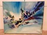a painting of a blue and white abstract painting on a wooden floor