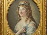 portrait d'une jeune femme en robe bleue, encadré d'un cadre doré