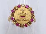an image of a close up of a gold ring with a pink stone