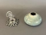 two vases sitting next to each other on a table