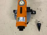 an orange machine that is sitting on the floor