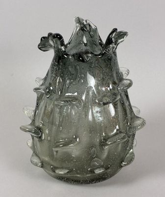 a glass vase that is sitting on a table