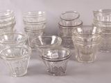 a lot of glasses that are sitting on a table