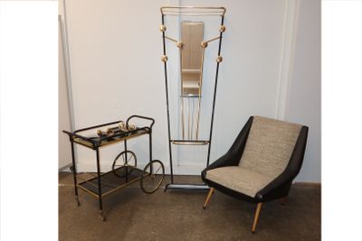 a chair and a table in a room with a clock on the wall