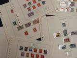 several different types of stamps are displayed on a table
