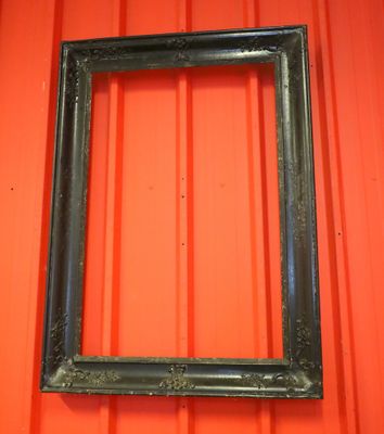 a picture of a picture frame hanging on a red wall