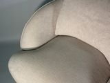 a chair that has a pillow on top of it
