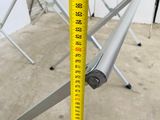 a picture of a measuring tape on a stand in a room